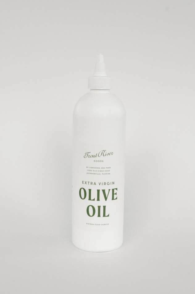 Bottle of Congaree and Penn olive oil with a dark glass bottle and label, set against a neutral background.