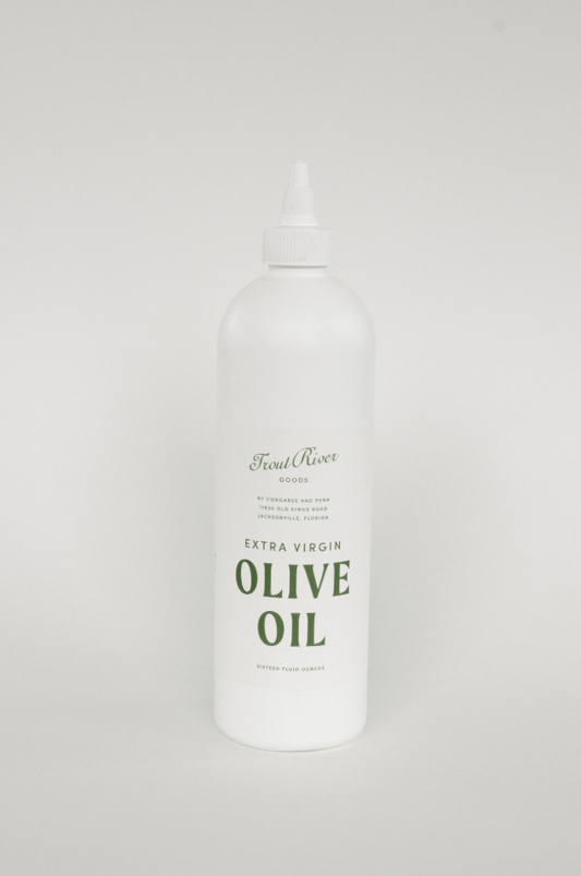 Bottle of Congaree and Penn olive oil with a dark glass bottle and label, set against a neutral background.