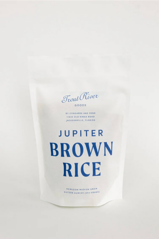 Screenshot of Congaree and Penn Jupiter Brown Rice grains in a clear container, showcasing the light brown rice texture.