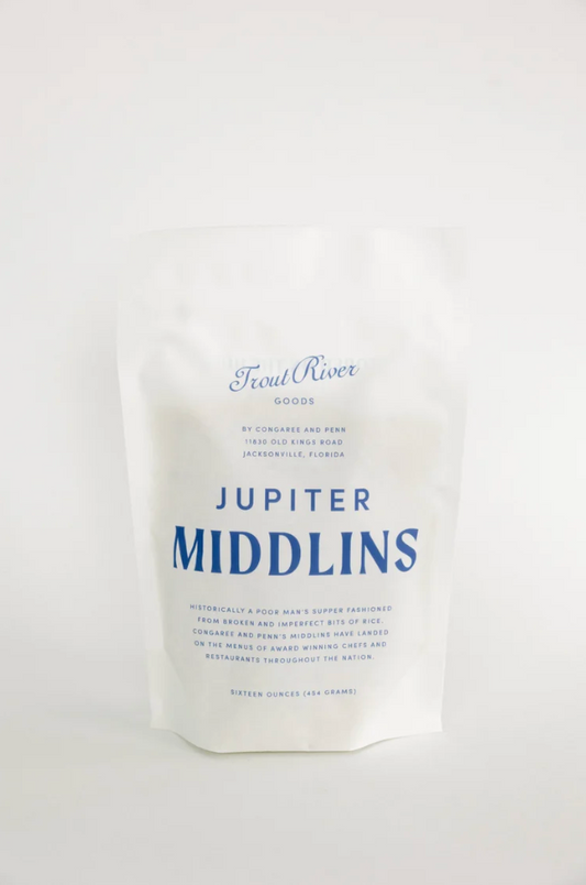 Congaree and Penn Jupiter Rice Middlins grains in a bowl, showcasing the textured rice middlins on a neutral background.