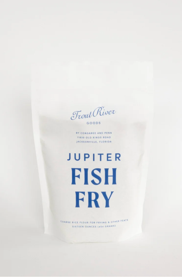 Image of Congaree and Penn Fish Fry grains in a clear container, showing the golden-brown seasoned fish breading mixture.