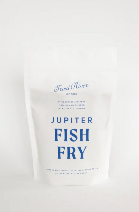 Image of Congaree and Penn Fish Fry grains in a clear container, showing the golden-brown seasoned fish breading mixture.