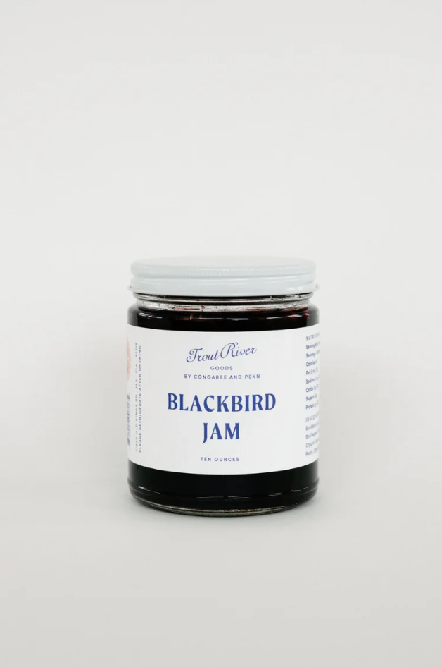 Congaree and Penn Blackbird Jam preserves jar with blackberries, showcasing the rich, dark berry spread in a clear glass jar.