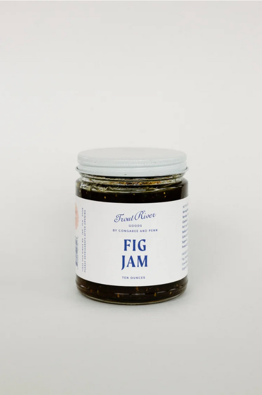 Close-up of Congaree and Penn fig jam preserves jar with golden fig preserves and rustic label, showcasing the product's texture.