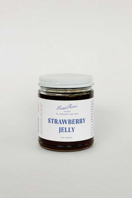 Jar of Congaree and Penn strawberry jelly preserves with a clear label showcasing fresh strawberries and vibrant red color.