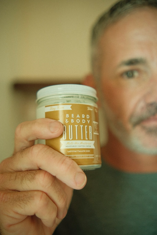 The Lady May Tallow Man Bay Rum Beard and Body Butter in a 9oz jar, creamy lotion with bay rum scent for men's grooming.