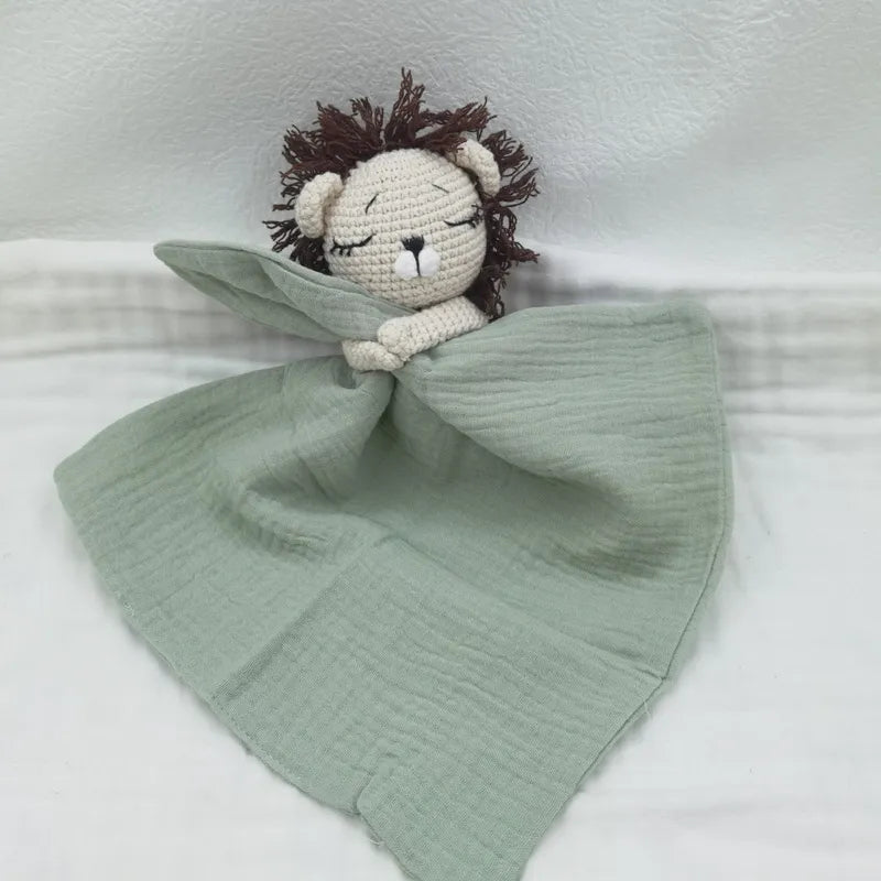 Baby bib with sleeping animals and rattle from Petite Pioneers, featuring soft fabric and playful animal designs.