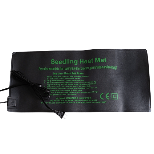 Hasty Roots seedling heat mat for gardening supplies, showing a close-up of the black mat with seedlings growing on it.