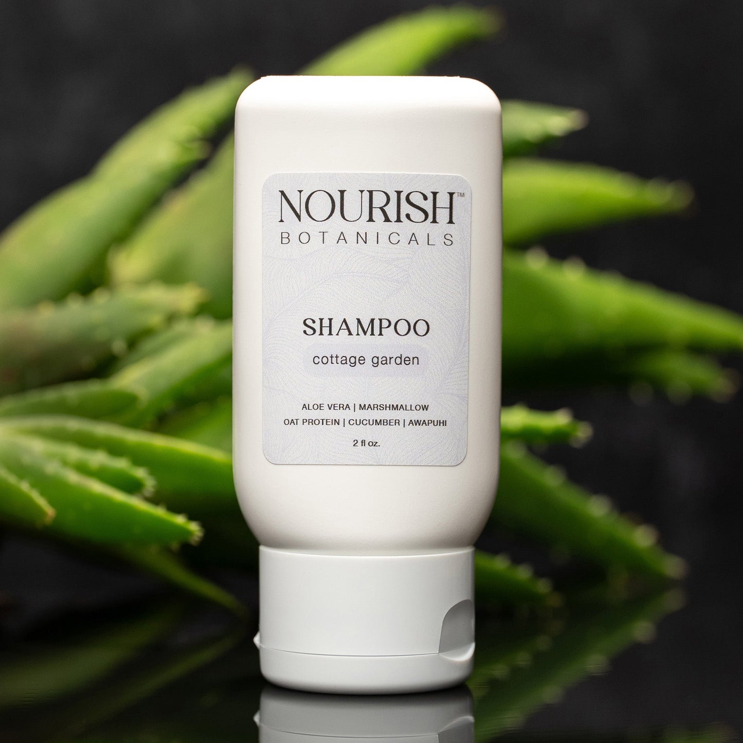 Rustic Strength Aloe Vera Shampoo bottle from Cottage Garden, 2 oz size, with a green label and natural botanical design.