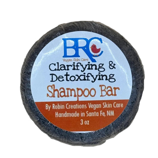 By Robin Creations clarifying and detoxifying shampoo bar, natural hair care product with a sleek soap-like design.