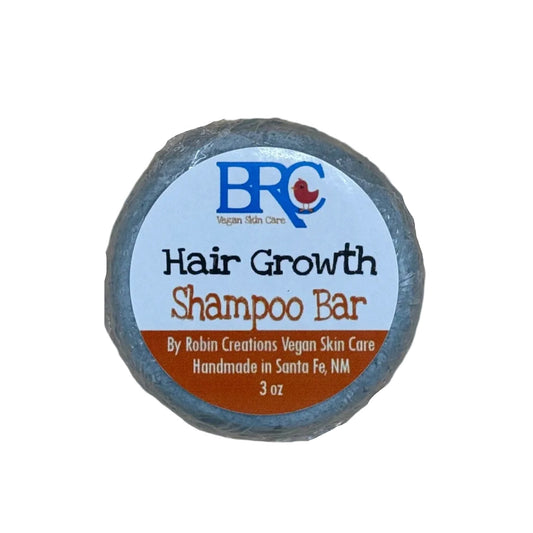 By Robin Creations hair growth shampoo bar with natural ingredients, shown in a sleek packaging on a white background.