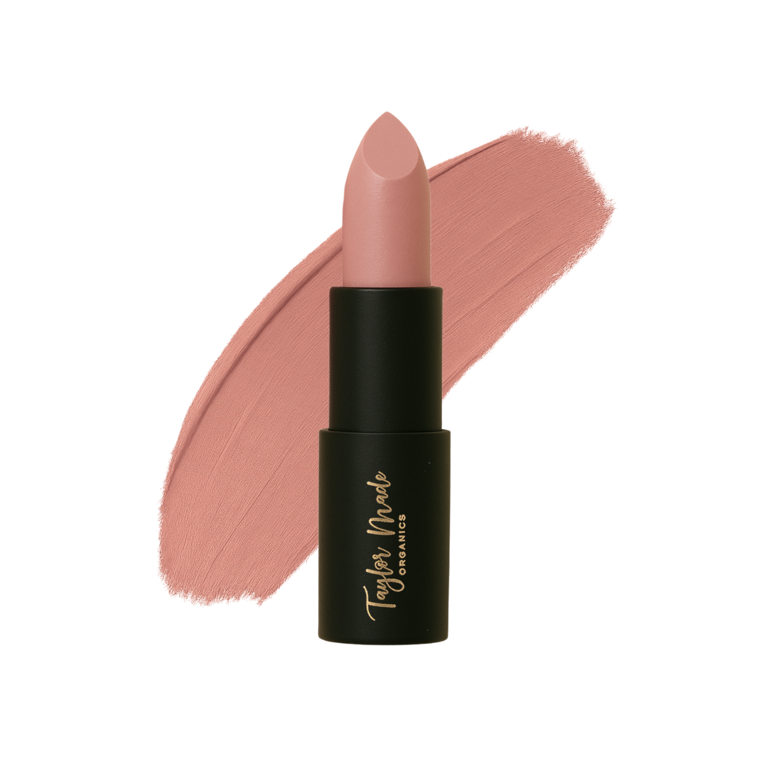 Organic lipstick by Taylor Made Organics in a sleek tube with a deep red shade, ready for application.