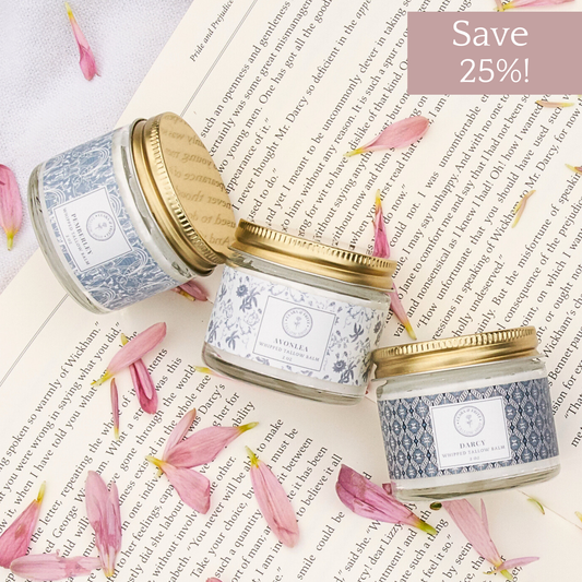 Clara & Fritz Tallow Shop Signature Scent Trio of lotion and moisturizer bottles with elegant packaging and floral accents.