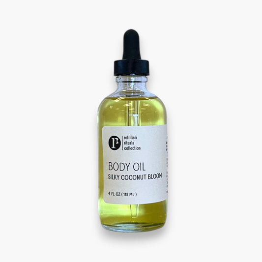 Refillism Silky Coconut Bloom body oil bottle, personal care product with a smooth, silky coconut scent and nourishing formula.