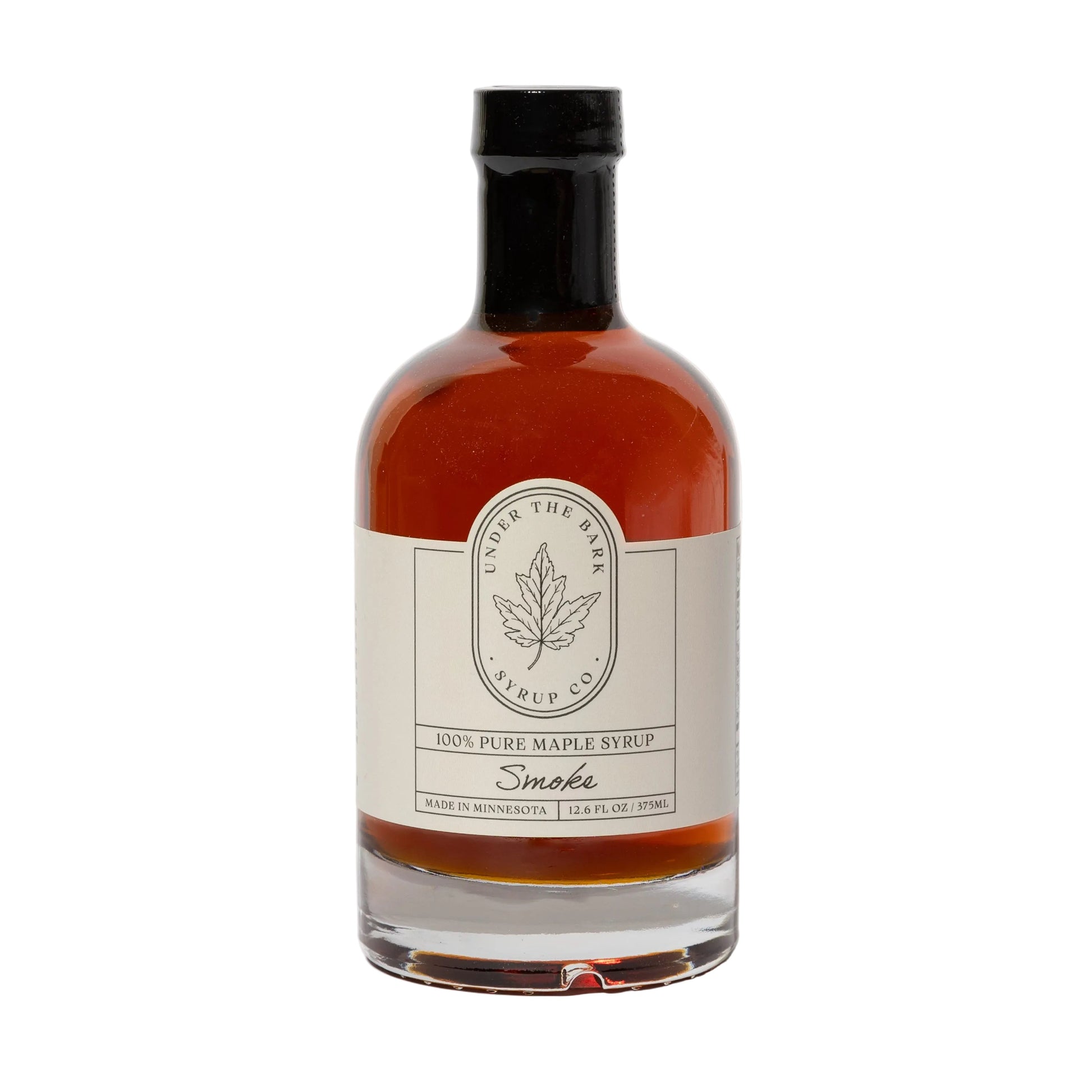 12oz bottle of Smoke Maple Syrup by Under The Bark Syrup Co, showcasing rich, dark syrup with a smoky aroma.