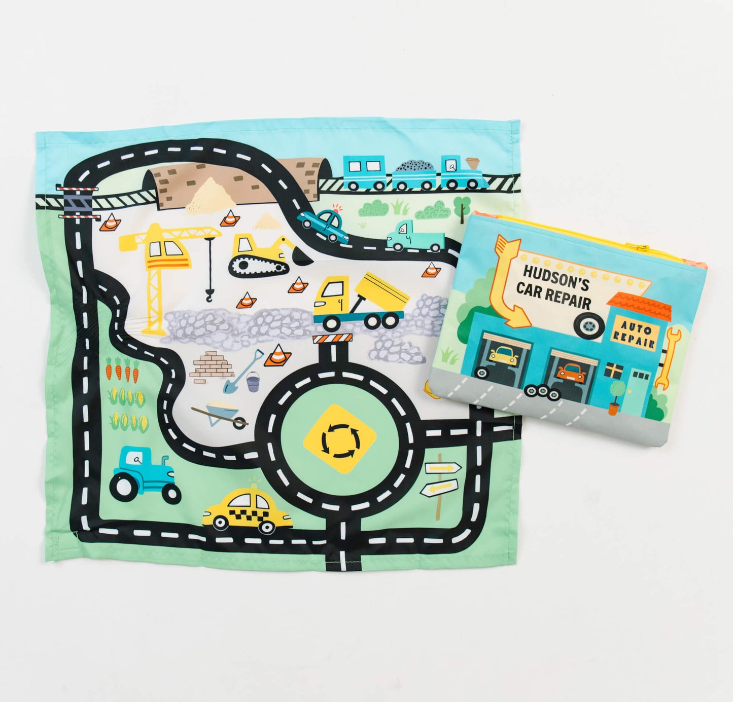 Colorful toy car playmat and pouch by So Handmade Shop, featuring roads and city scenes for kids' travel entertainment.