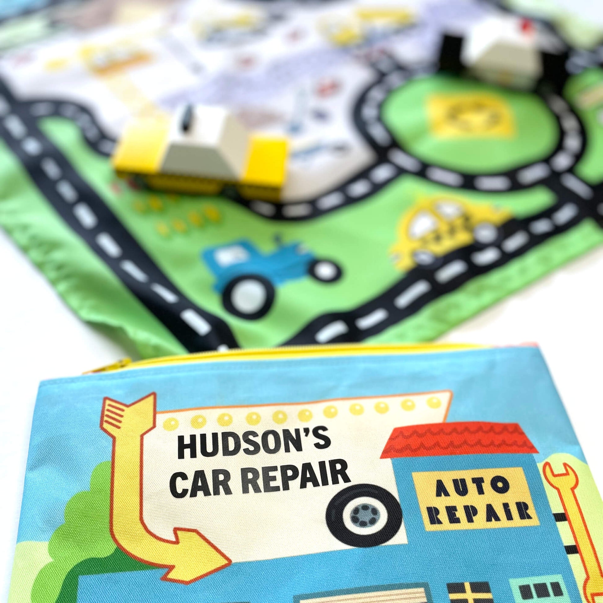 Colorful toy car playmat and pouch by So Handmade Shop, featuring a vibrant road design for kids' travel entertainment.