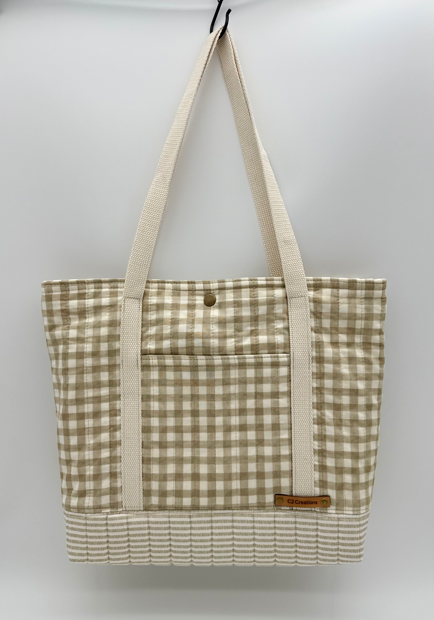 Handmade taupe and cream gingham tote bag with quilted bottom, front view by C2 Creations LLC.