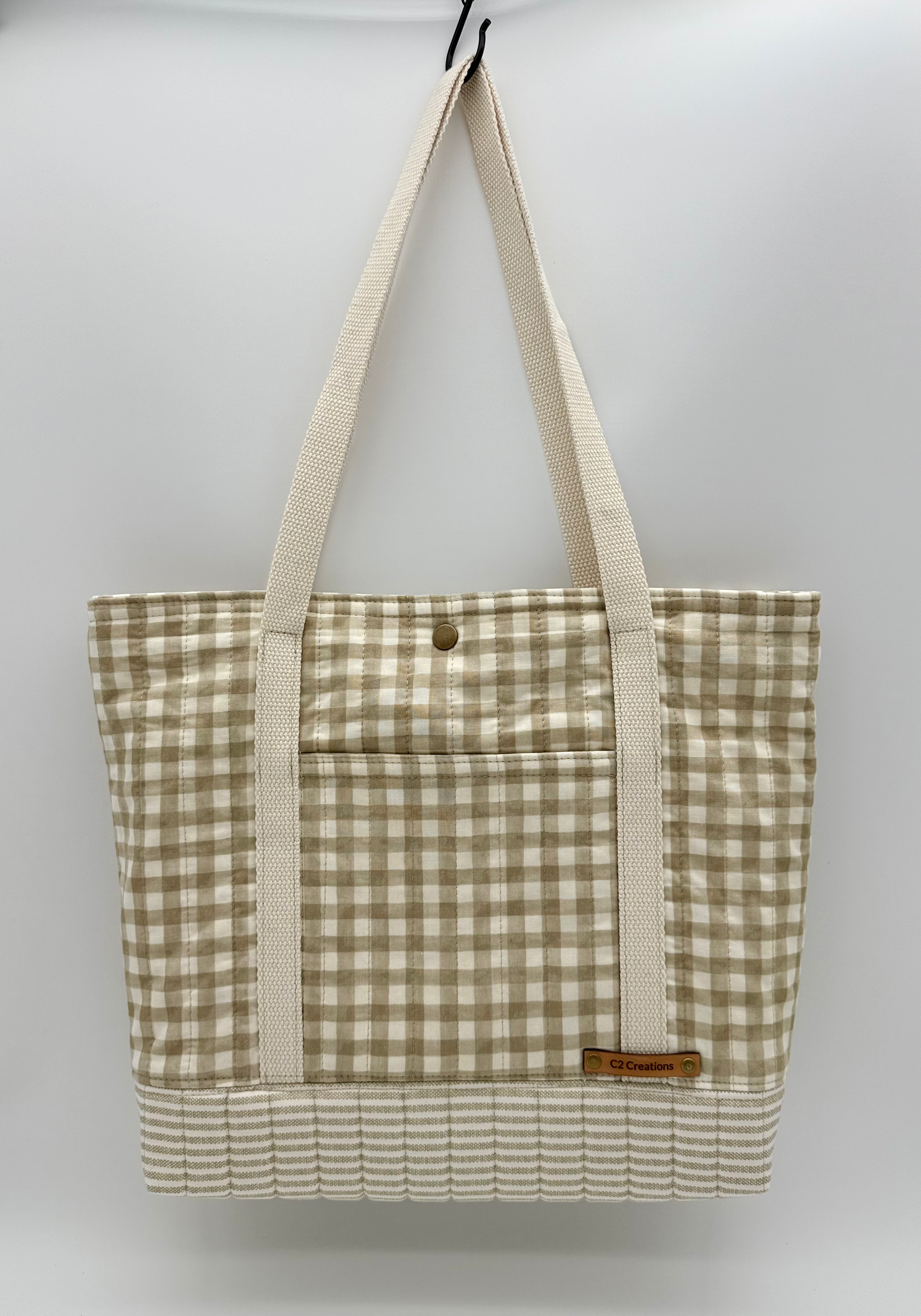 Handmade taupe and cream gingham tote bag with quilted bottom, front view by C2 Creations LLC.