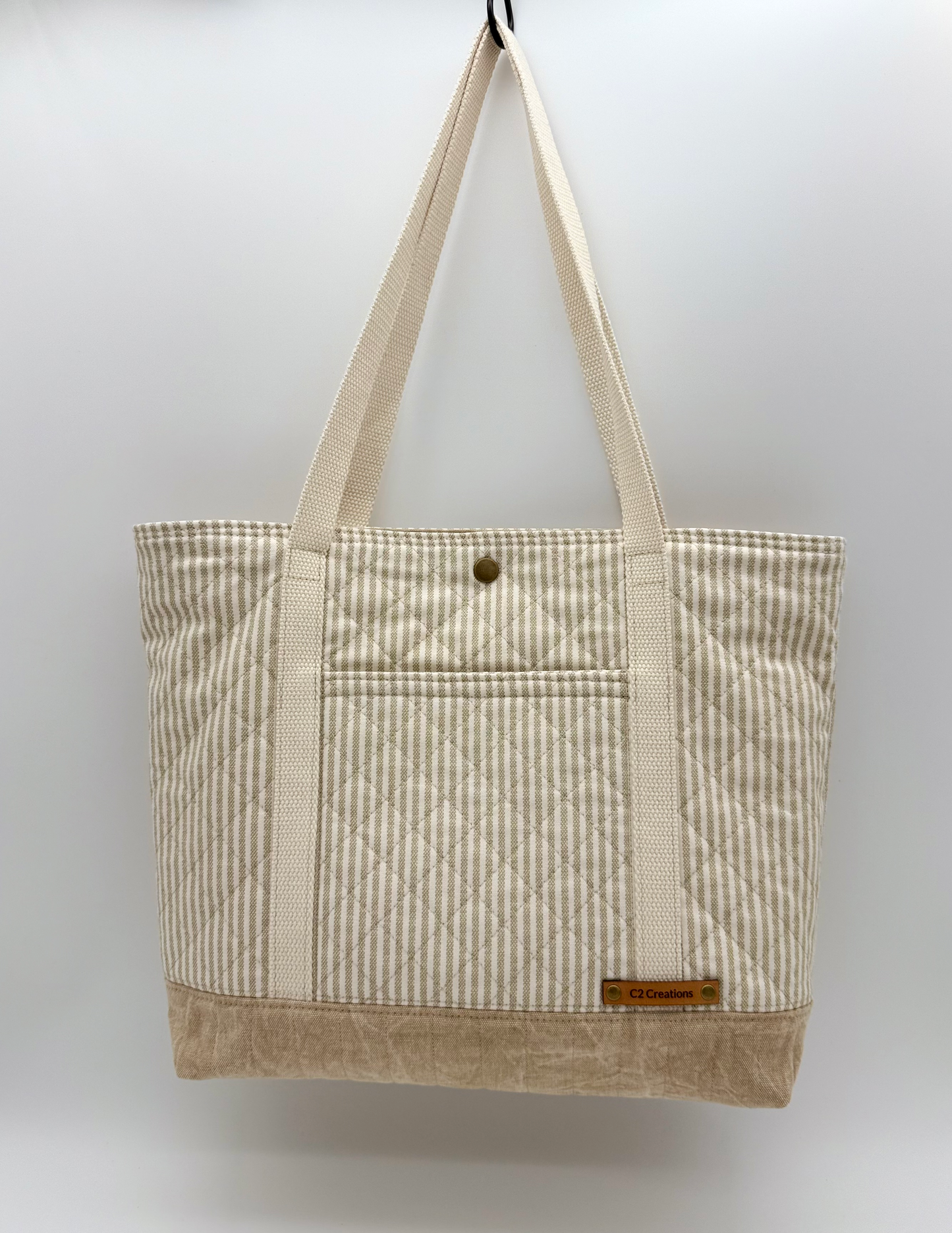 Taupe striped quilted tote bag by C2 Creations LLC, handmade canvas with front view and snap closure.