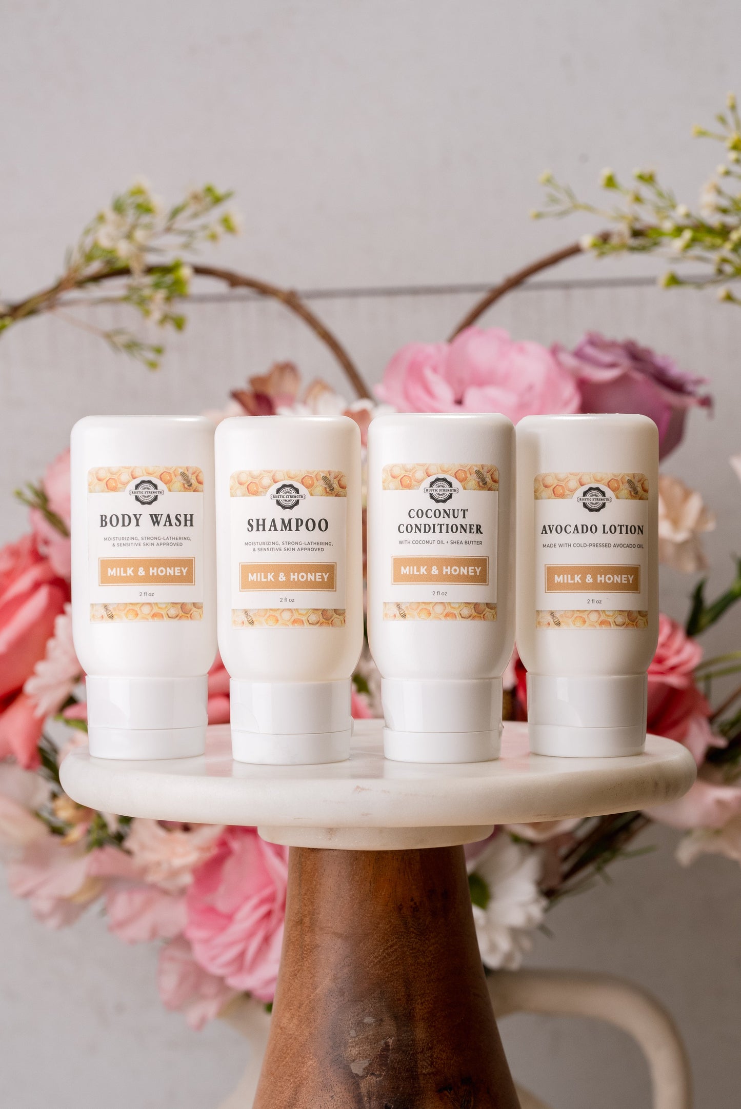 Rustic Strength Milk & Honey travel bath and body kit with 2 oz bottles, includes skincare and body care products in a compact set.
