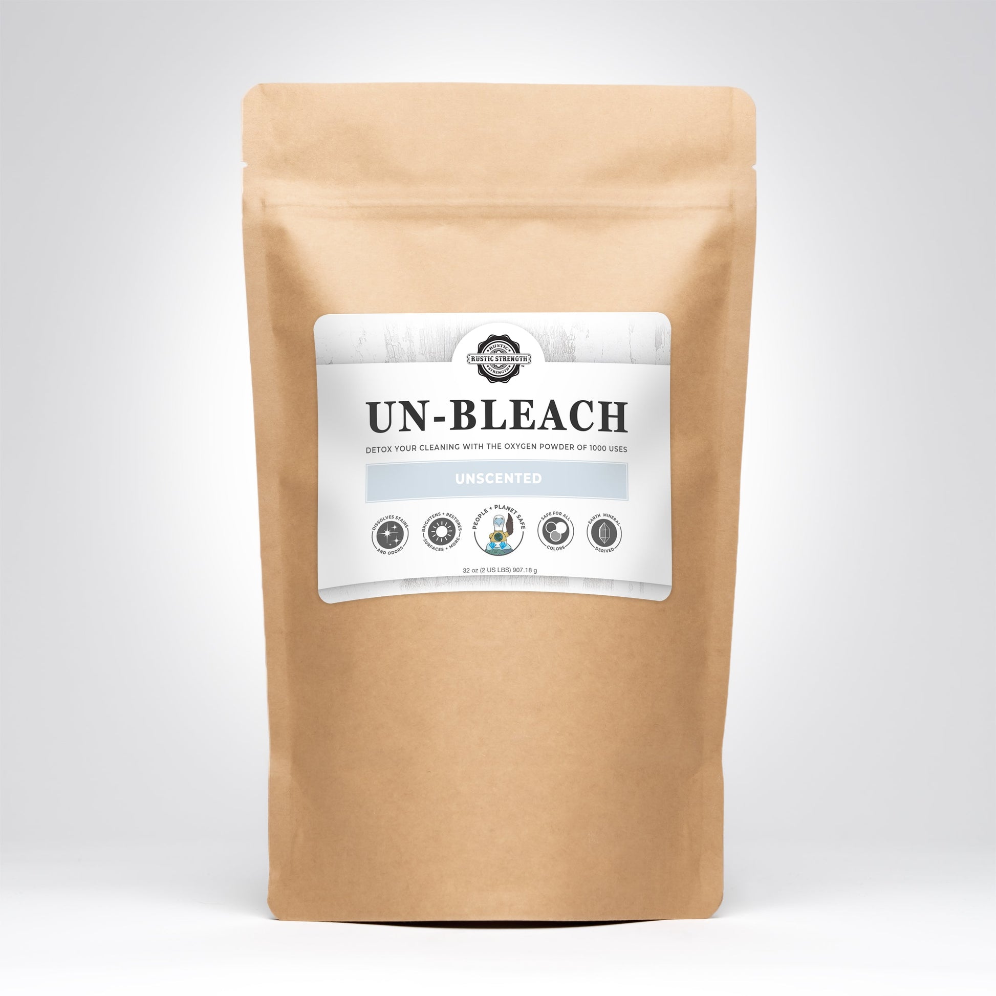 A brown resealable pouch from Rustic Strength with a white label reading Un-Bleach Unscented, featuring eco-friendly icons—a toxin-free bleach alternative that naturally brightens surfaces.