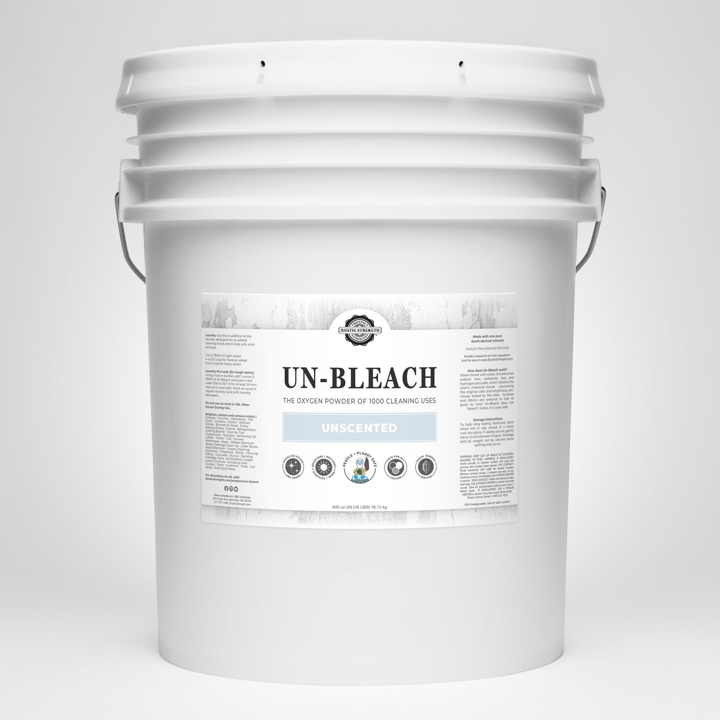 A large white plastic bucket with a handle, labeled Un-Bleach by Rustic Strength, showcases detailed product info and promotes its toxin-free, unscented bleach alternative for effective stain removal.