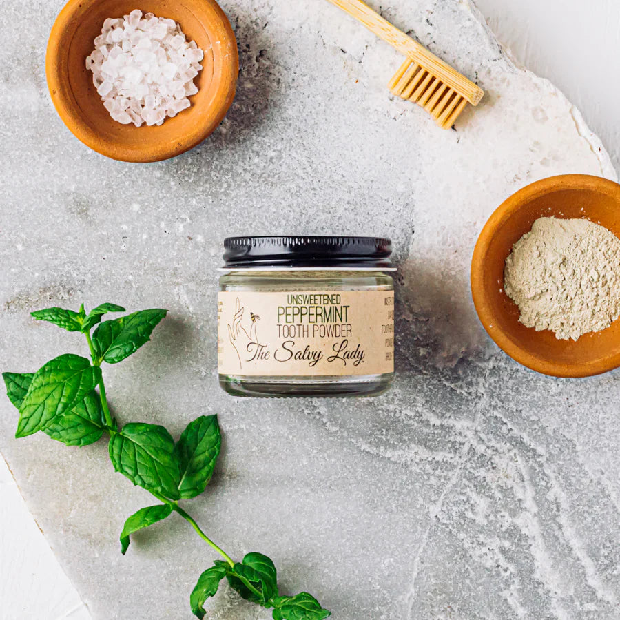 Unsweetened peppermint tooth powder by The Salvy Lady in 2 oz container, fluoride-free, natural dental care product.