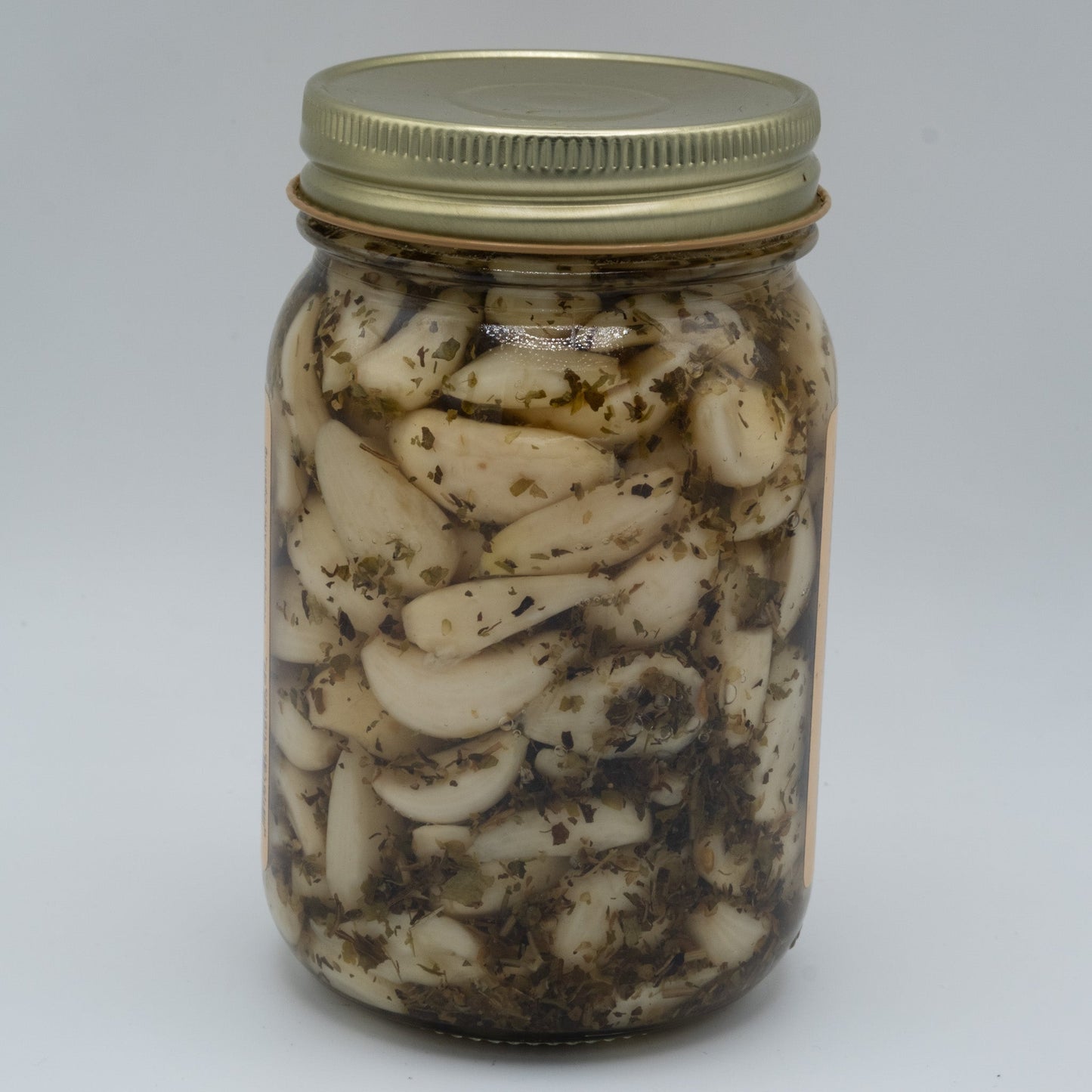 Canned Amish Country Store Savory Italian Garlic in 16oz jar, showing garlic cloves and label on the can.