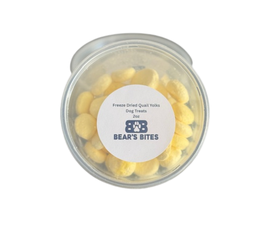 Freeze dried quail egg yolks for dog food from Bear's Bites, shown in crispy, golden pieces on a white background.