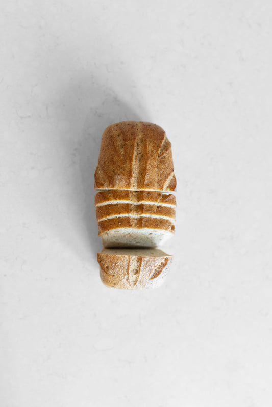 Heaven Gluten Free Bakery Caraway Sourdough vegan gluten-free loaf sliced with visible caraway seeds on top
