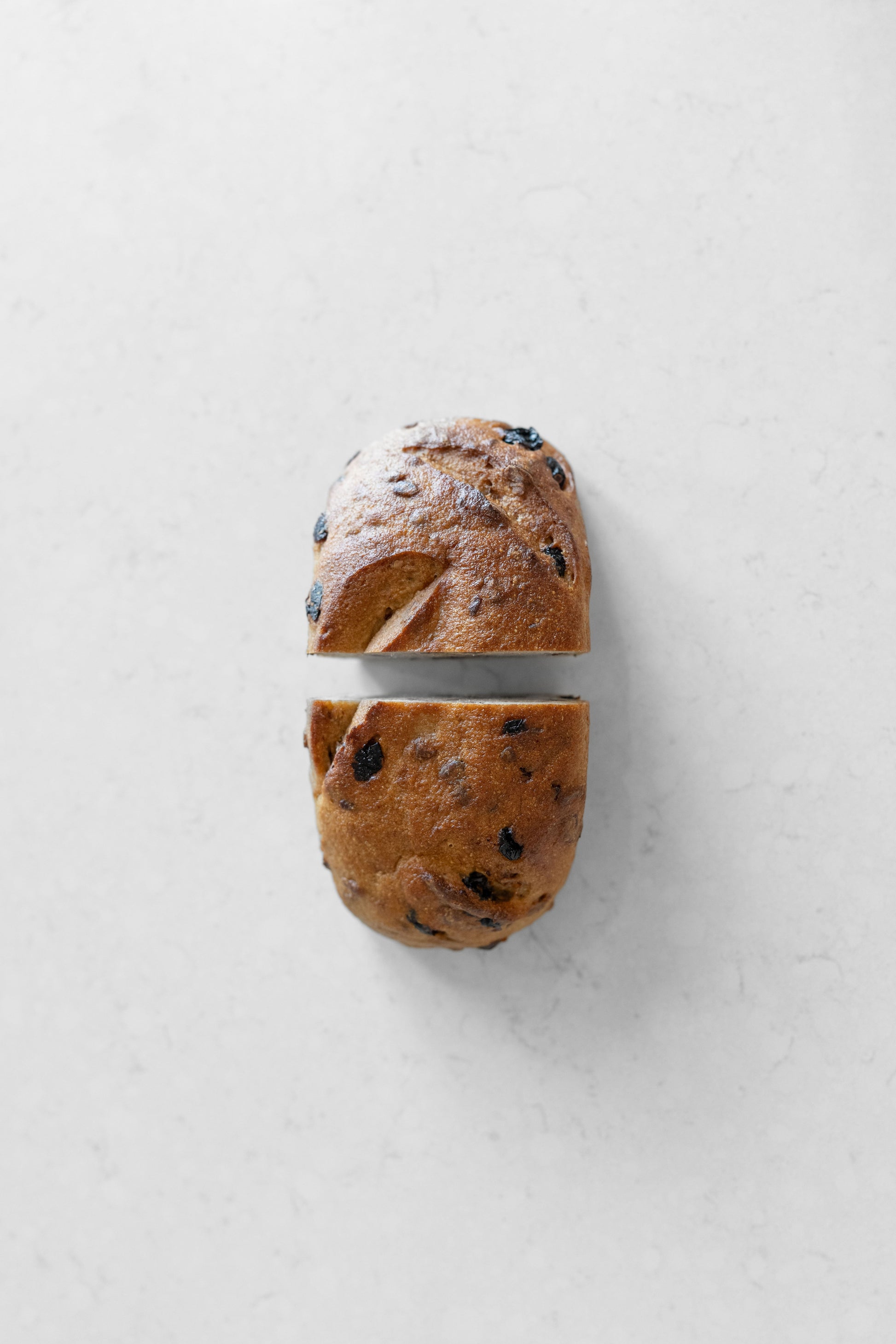Heaven Gluten Free Bakery cranberry and pecan vegan sourdough loaf with visible cranberries and pecans on crust.