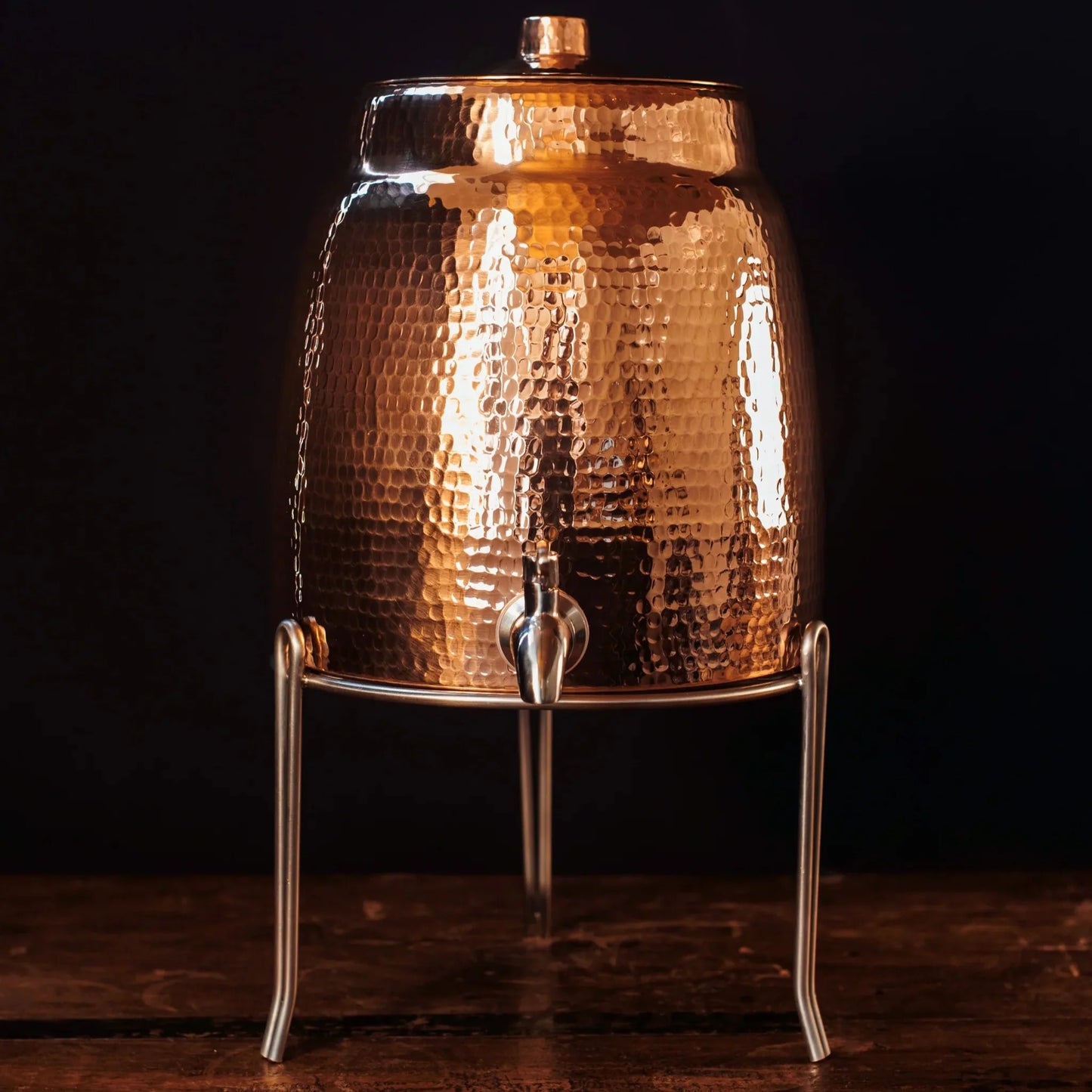 Stainless steel Sertodo water dispenser stand with sturdy legs and a sleek design for supporting water dispensers.