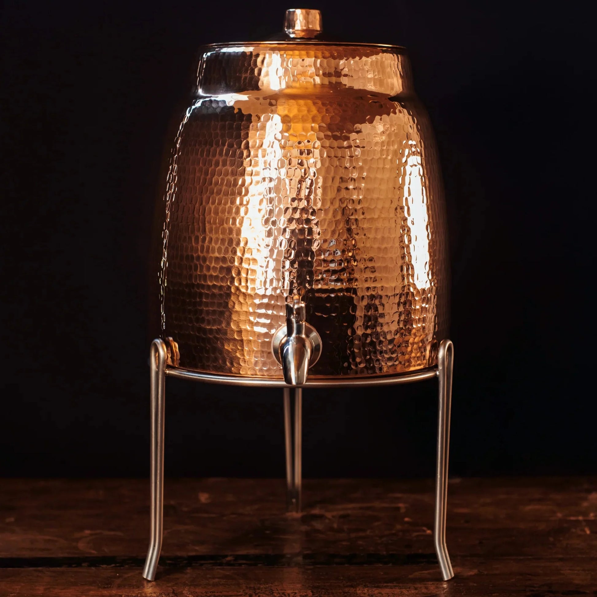 Stainless steel Sertodo water dispenser stand with sturdy legs and a sleek design for supporting water dispensers.