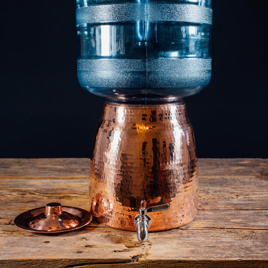 Sertodo water dispenser spigot attached to a water jug, designed for easy pouring and dispensing water.