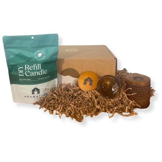 Bluecorn Candles Aromática DIY scented candle gift set in glassware, featuring a woodsy fragrance and beautifully arranged in a gift box.