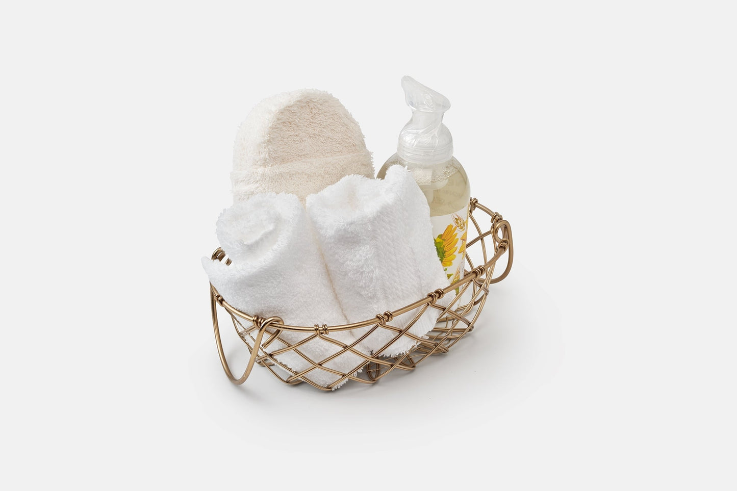 Set of white luxury American Blossom Linens bathroom washcloths made of natural USA cotton in a basket, perfect for gentle bath use.