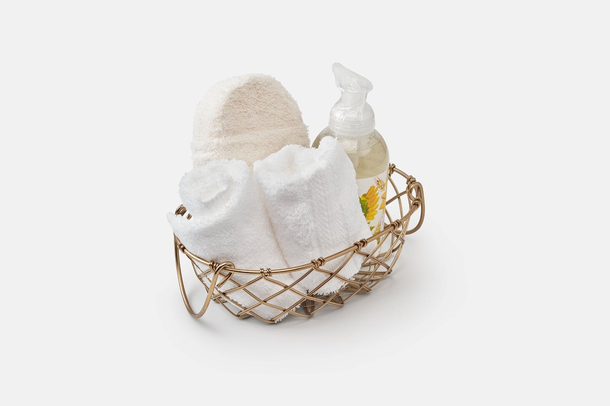 Set of white luxury American Blossom Linens bathroom washcloths made of natural USA cotton in a basket, perfect for gentle bath use.