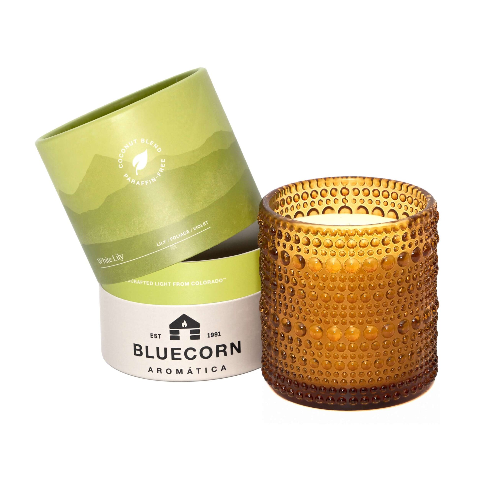 Bluecorn Candles White Lily Scented Candle in glassware, with white lily design and coconut wax, creating a calming ambiance.