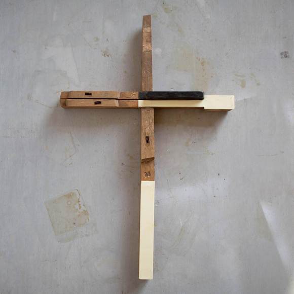 Wooden piano key crosses by Dennehey Design Co. featuring handcrafted cross with piano key design, ideal for worship or religious decor.