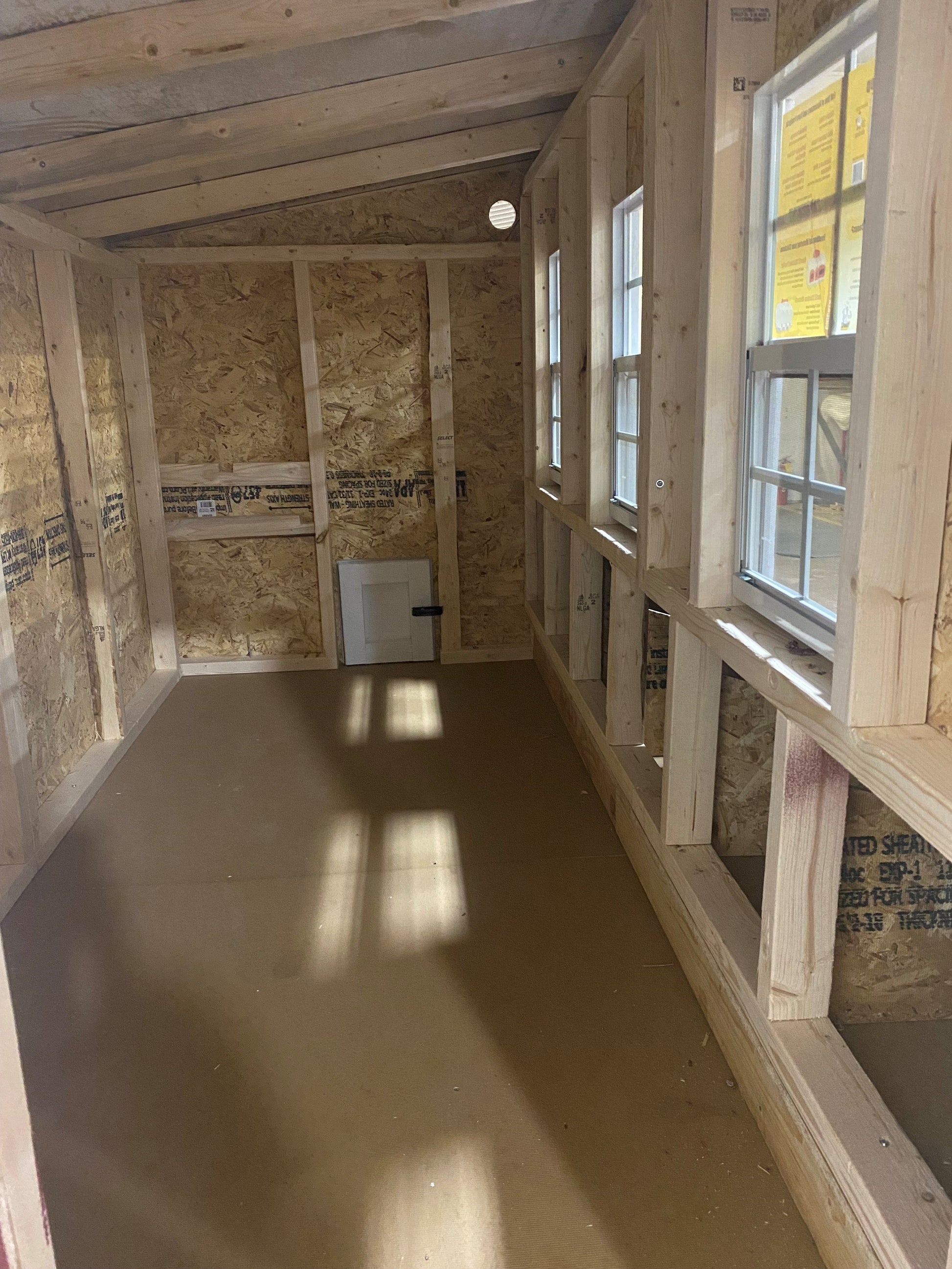 Interior view of OverEZ XL Chicken Coop designed for up to 20 chickens, showing spacious nesting areas and sturdy construction.