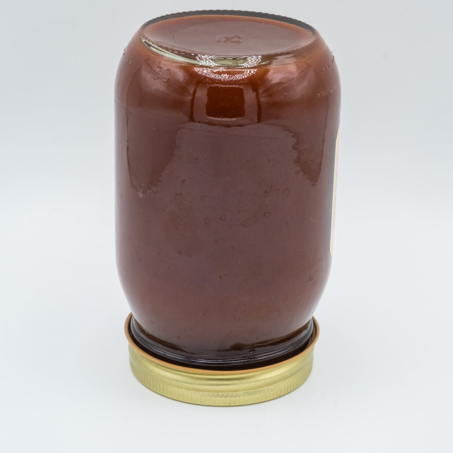 Canned Amish Country Store Apple Butter BBQ Sauce 16 oz jar with a rustic label and lid, ready for grilling or dipping.