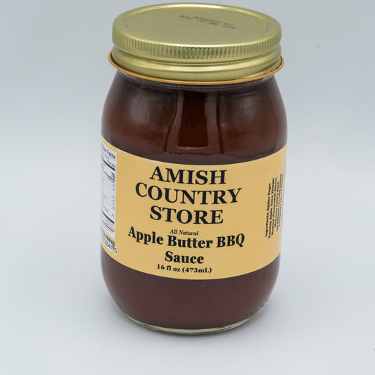 Canned Amish Country Store Apple Butter BBQ Sauce in 16 oz jar, showing the label and sauce inside the container