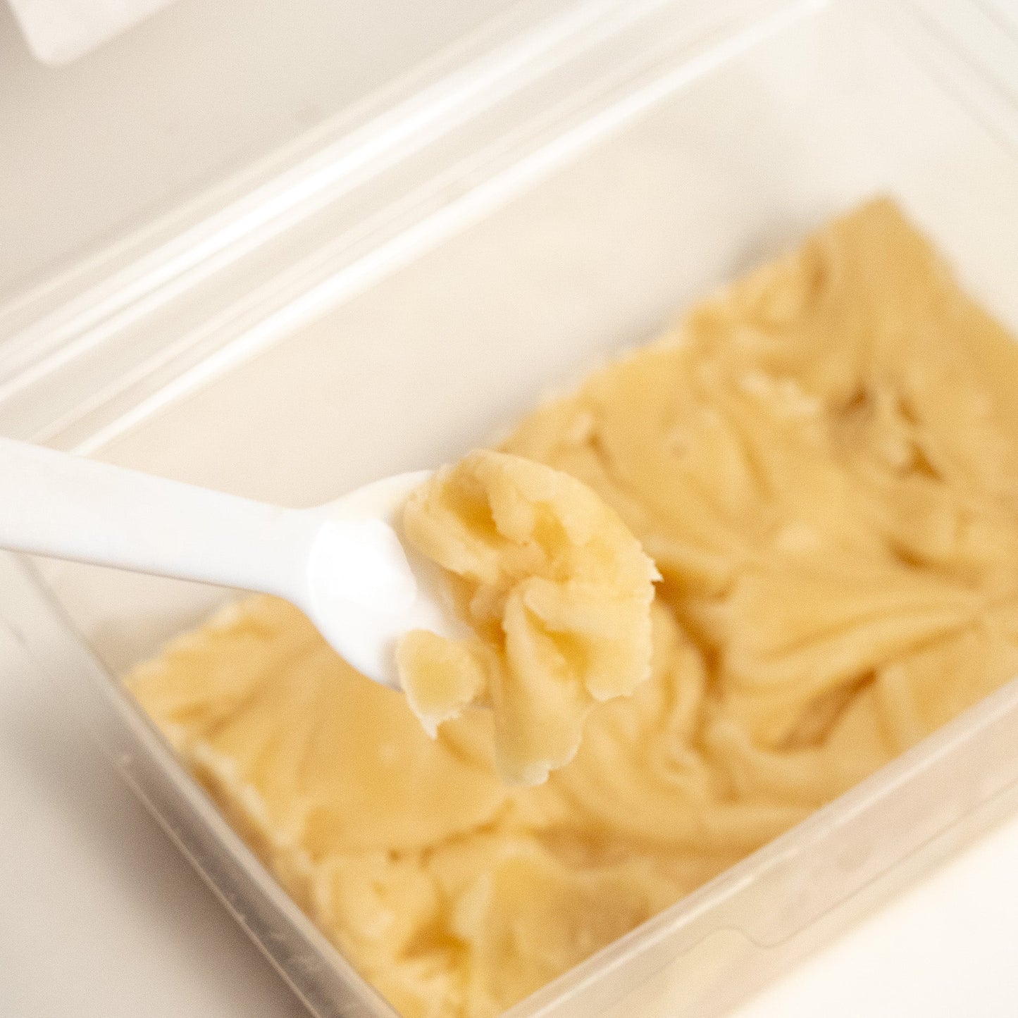 Aquidneck Honey Honey Fudge showing creamy, golden-brown fudge with a smooth texture and honey swirl pattern.