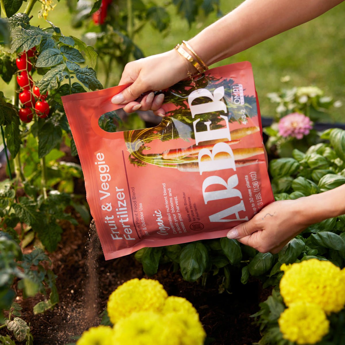 Organic Fruit and Veggie Fertilizer by Arber shown in a bag with fresh produce in the background.