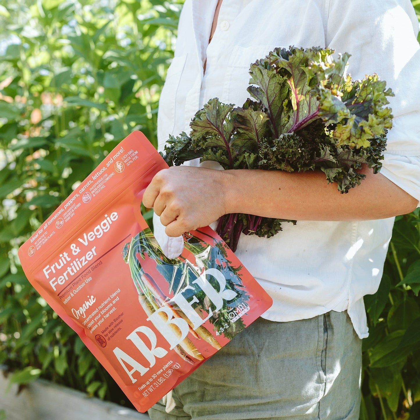 Organic fruit and vegetable fertilizer by Arber, showing a bag of natural plant nutrient for healthy produce.