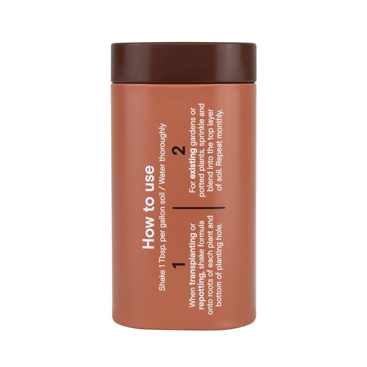 A brown cylindrical Arber bottle with dark brown lid features white text detailing instructions and benefits of Organic Soil & Root Boost, including how to shake, water, and apply it to new or existing plants for enhanced growth.