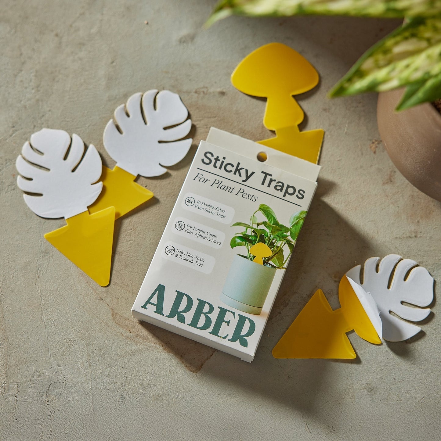 Arber sticky traps for plant pests, yellow adhesive strips designed to attract and capture insects on plants.