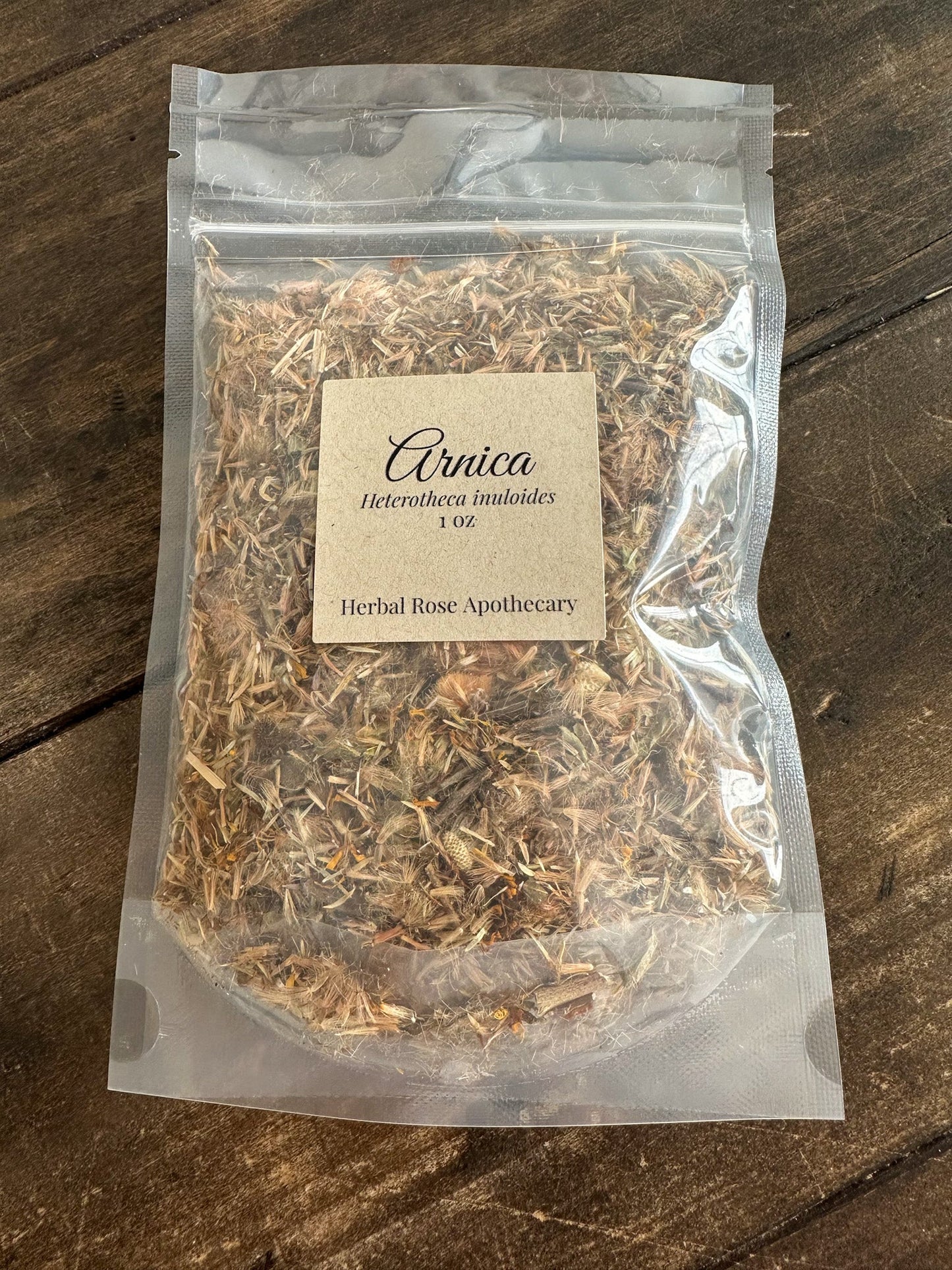 Dried Arnica Flowers in a 1oz package by Herbal Rose Apothecary, featuring vibrant yellow blossoms for herbal remedies.