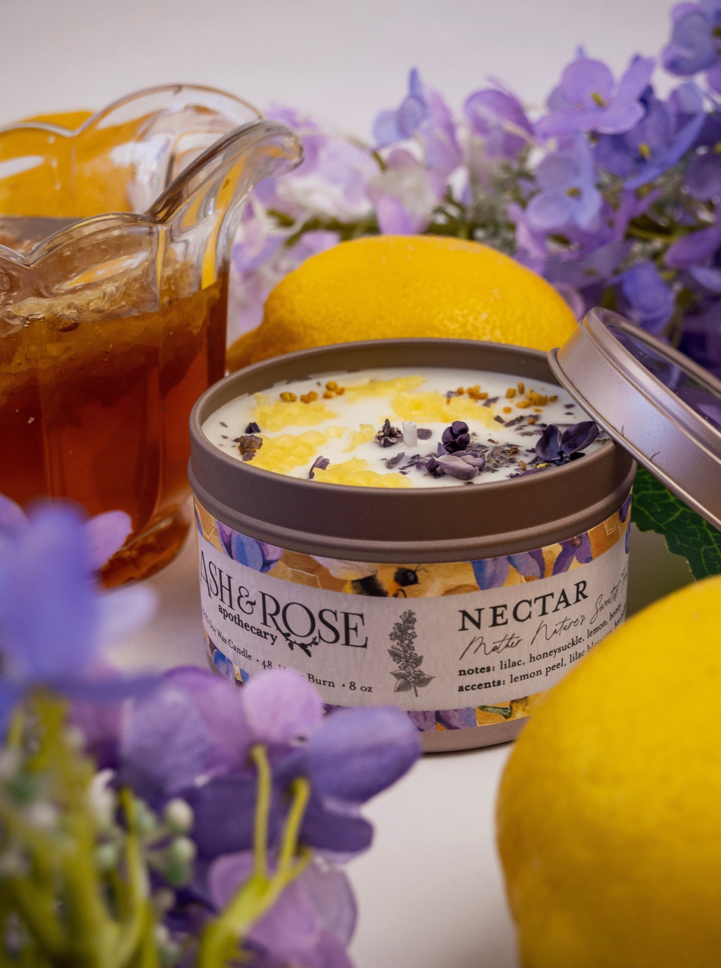 Ash & Rose Nectar Lilac Lemon Honey candle in a 4 oz jar with lilac, lemon, and honey scent, featuring a natural wax finish.